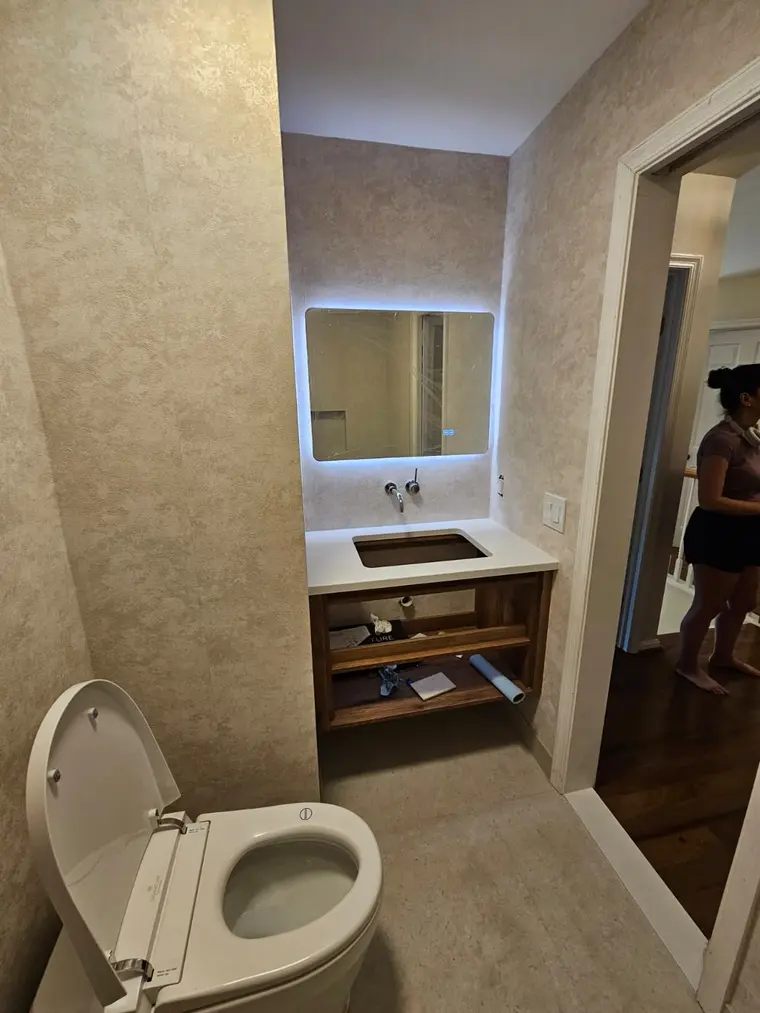 Walk-in shower with rain head and hand shower