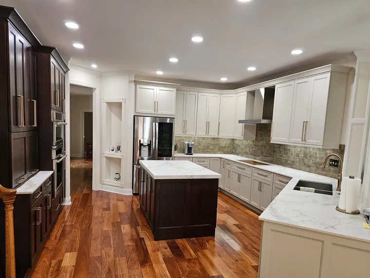 White kitchen with dark island, calacatta counters and hardwood floors, Northern Virginia