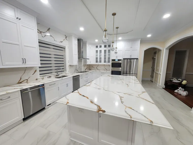 Large white kitchen with gold calacatta quartz waterfall island, Northern Virginia