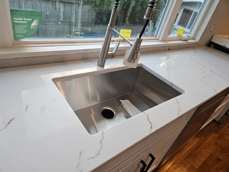 White kitchen with calacatta waterfall island and undermount sink, Northern Virginia